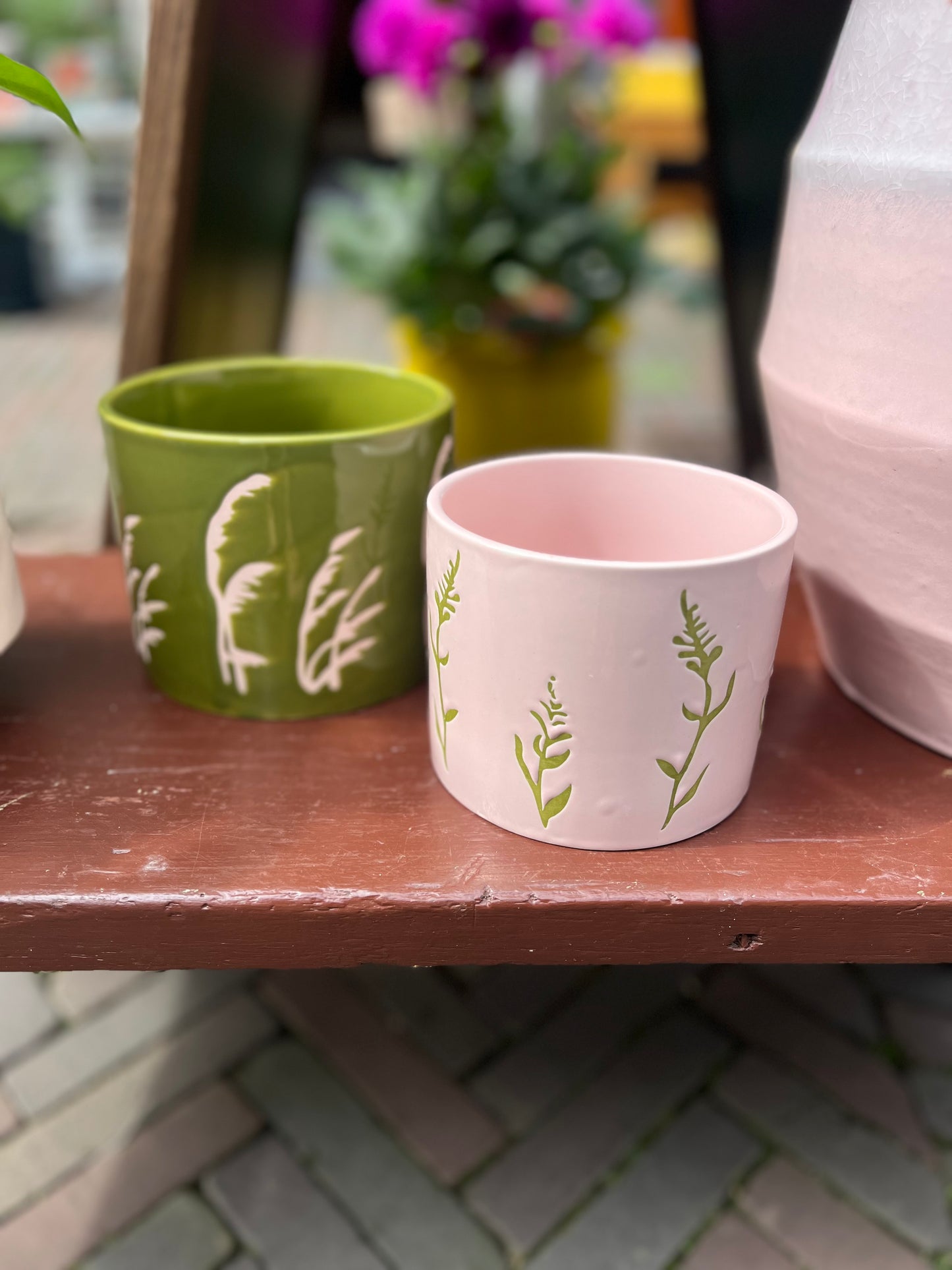 Bloempot groen met roze bloem