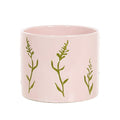 Bloempot roze met groene tak